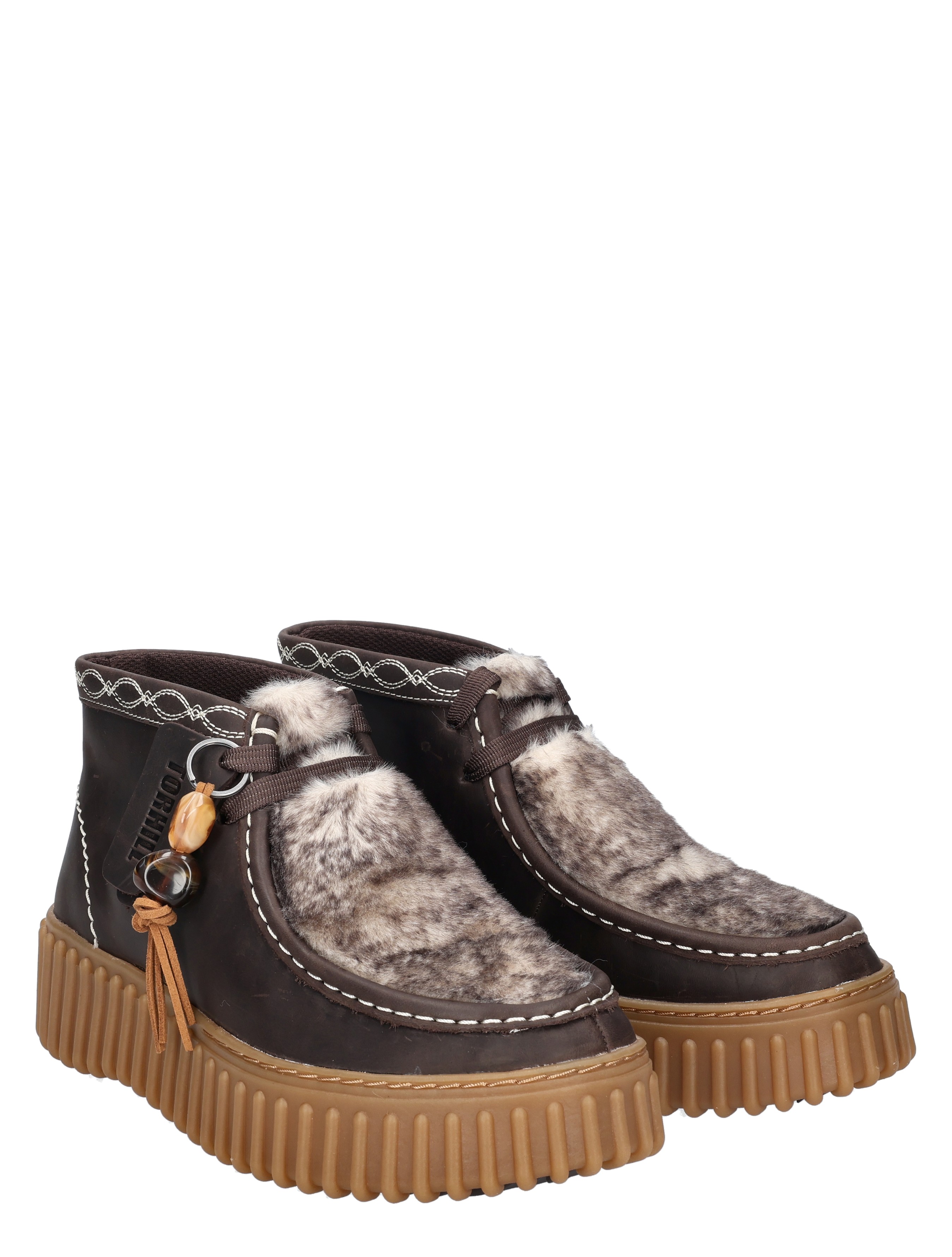 snow boots, fur lining, platform sole, buckled strap, quirky charm