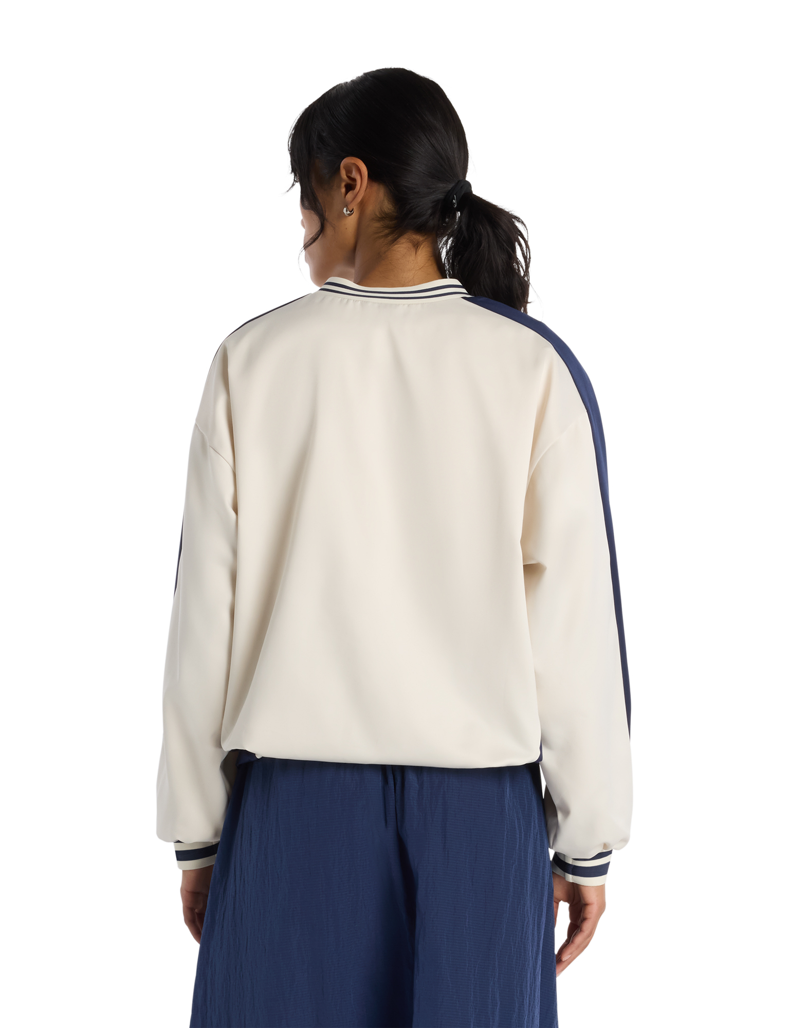 jacket, cream top, blue pants, back view, striped cuffs
